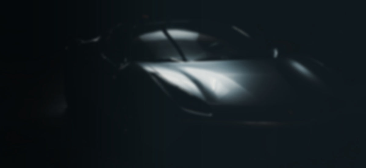 Sculpted dark sports car body emerging from shadow - RO34 aero and body kits