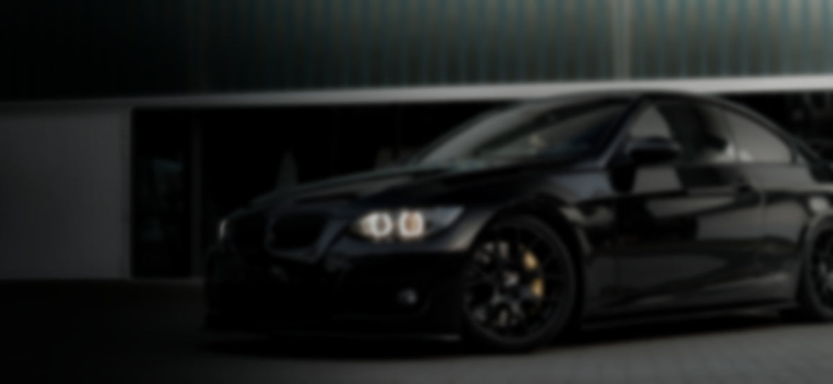 Lowered gloss black tuned coupe on split rims at dusk - RO34 coilovers and suspension