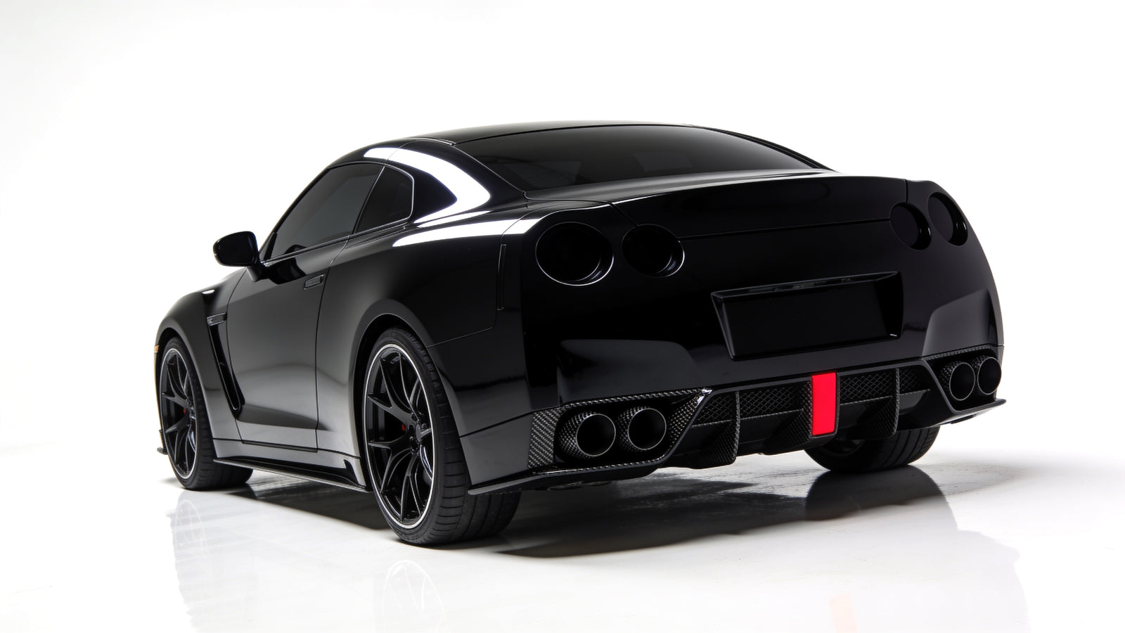 Stainless steel performance exhaust and downpipe in white studio setting - RO34 hero banner